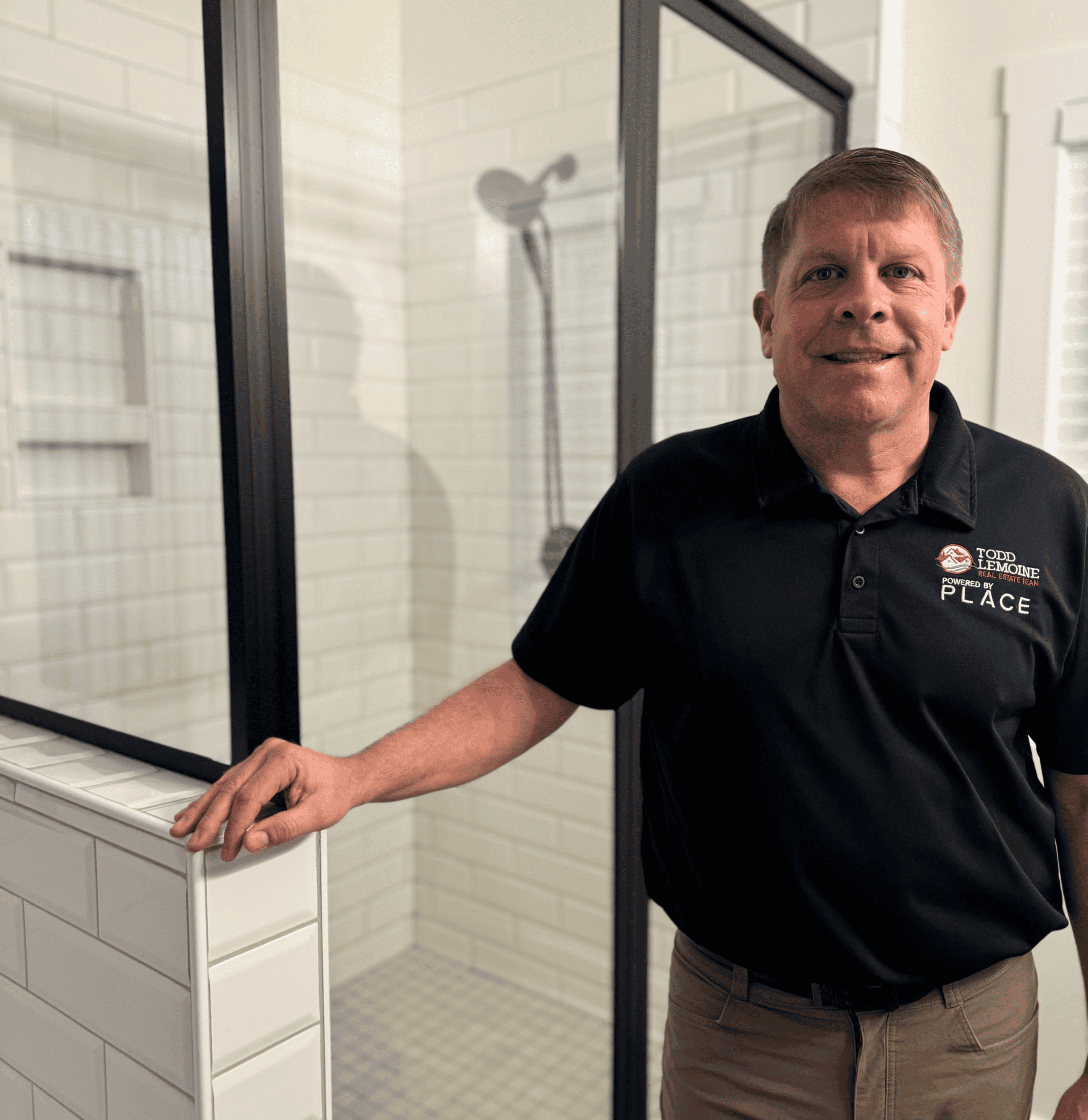 Professional shower installation by Example Co in a modern bathroom setting.
