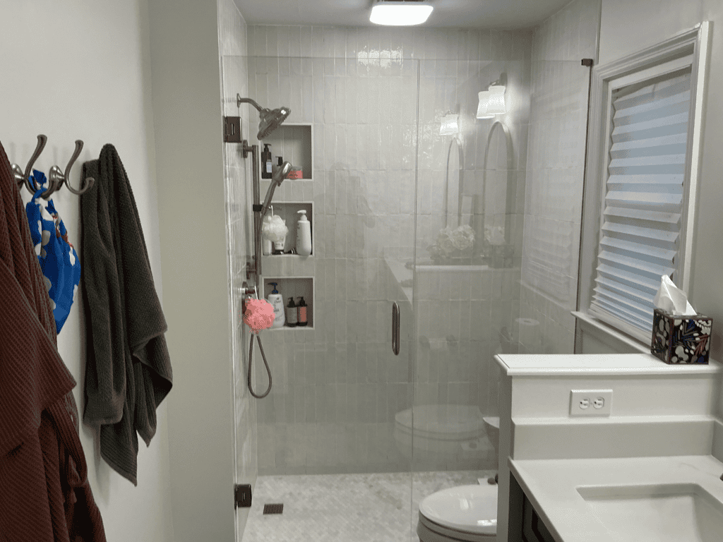 Bathroom shower with glass enclosure and modern fixtures.