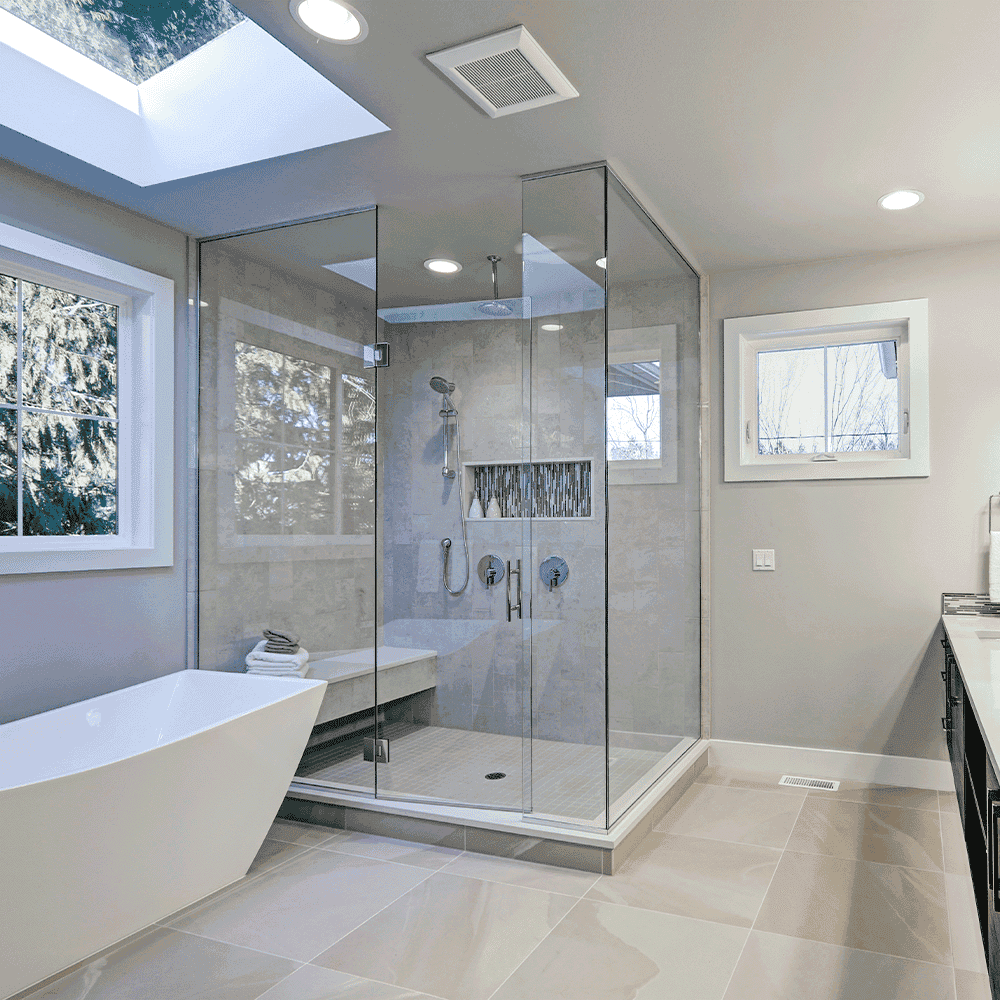Bathroom with glass-enclosed shower and freestanding bathtub.
