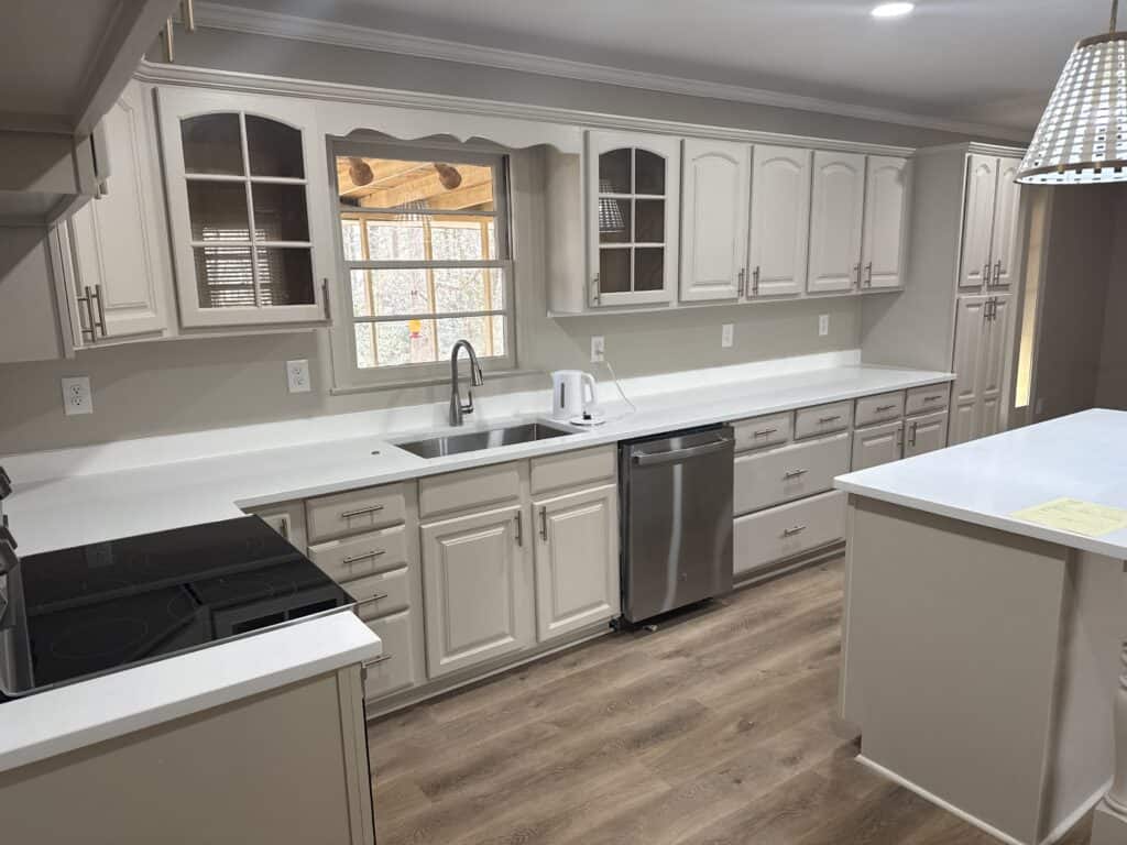 Kitchen with white cabinets and stainless steel appliances.
