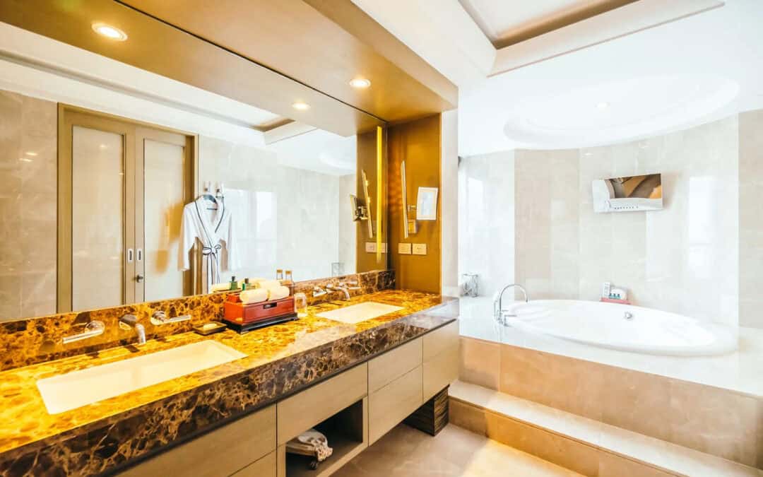 Luxury bathroom vanity with dual sinks and marble countertop.