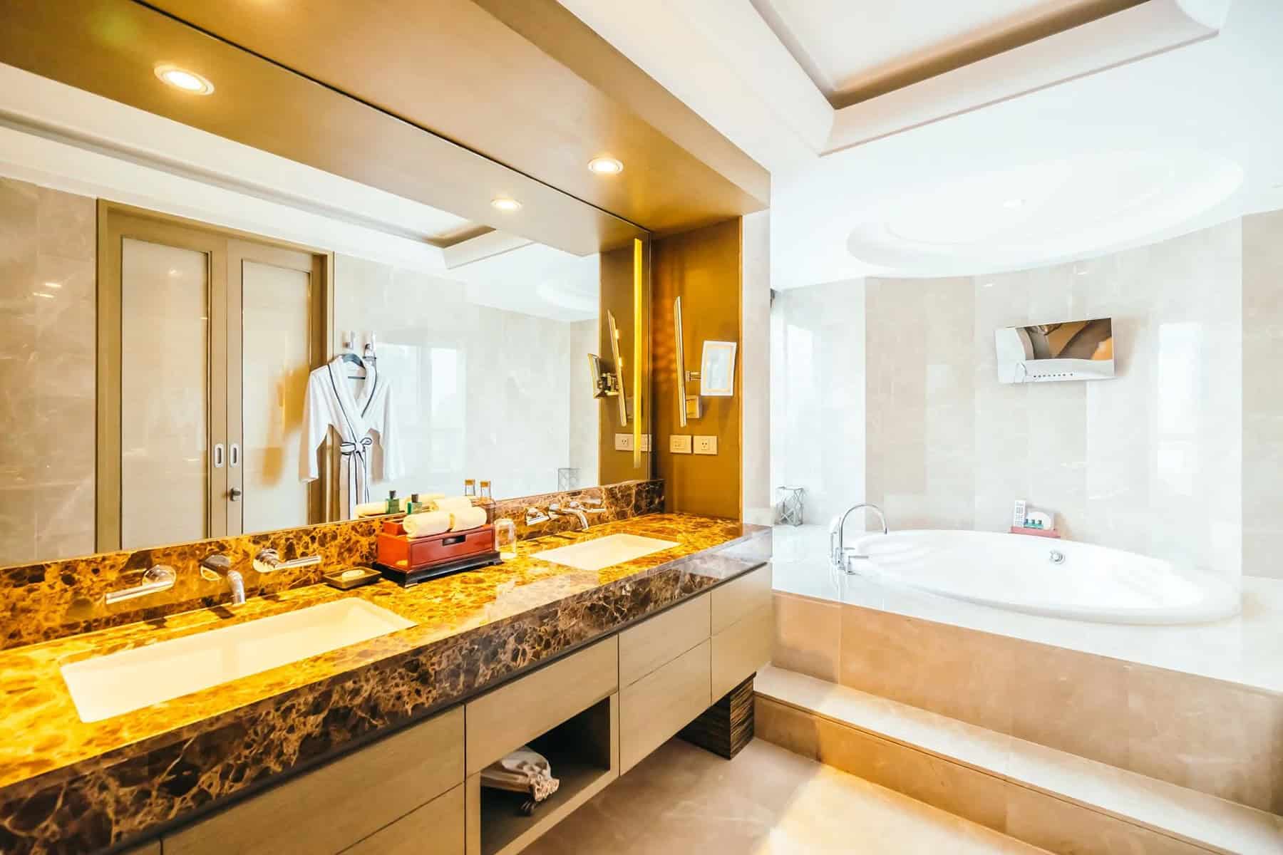 Luxury bathroom vanity with dual sinks and marble countertop.